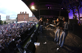 An artist performs at the Midsummer Magic Tour
